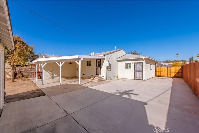 back of house featuring a patio area