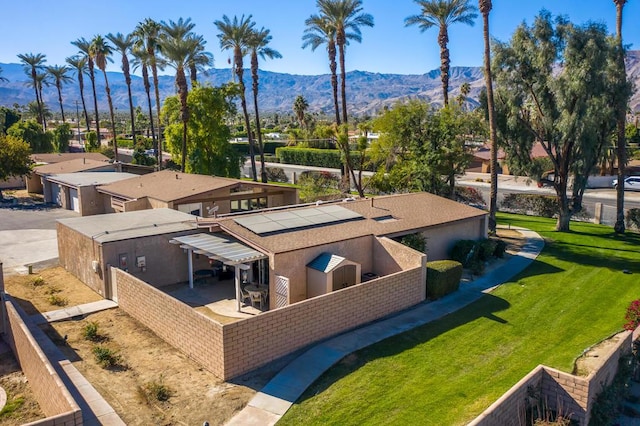 birds eye view of property featuring a mountain view