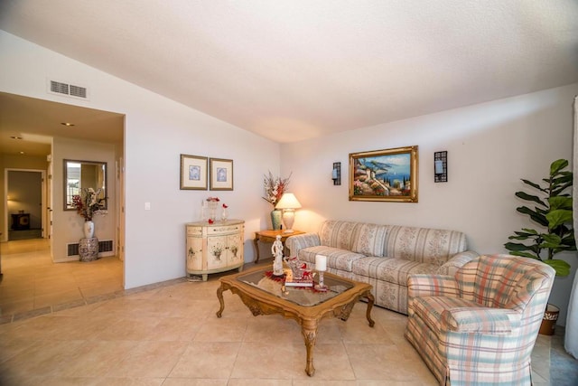 living room featuring light tile patterned floors and lofted ceiling