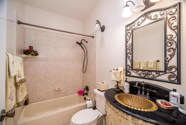 full bathroom with toilet, tiled shower / bath combo, and vanity