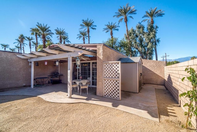 back of house featuring a pergola and a patio area