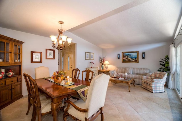 dining room with light tile patterned floors, a chandelier, and lofted ceiling