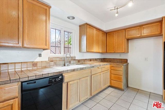 kitchen with dishwasher, light tile patterned floors, tile countertops, and sink