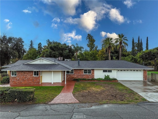 single story home with a front yard and a garage