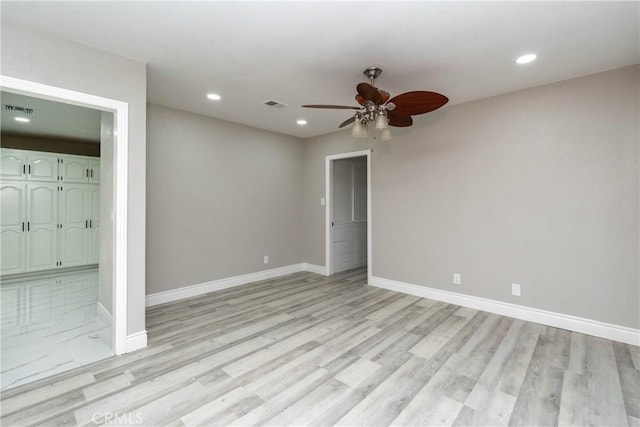 unfurnished bedroom featuring ceiling fan and light hardwood / wood-style flooring