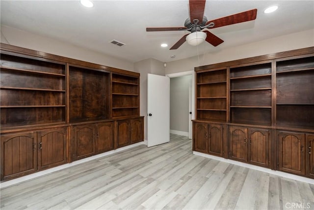 unfurnished living room with ceiling fan and light hardwood / wood-style floors