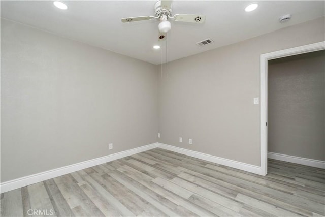 unfurnished room with ceiling fan and light hardwood / wood-style floors