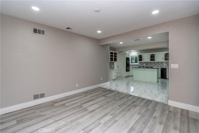 unfurnished living room with light wood-type flooring