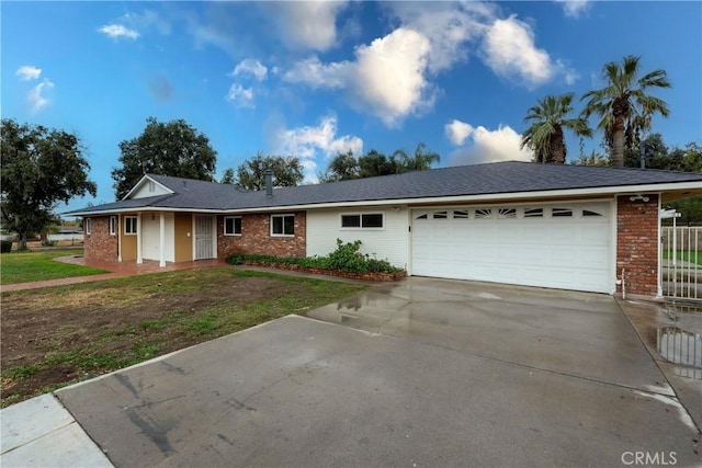 ranch-style house with a front yard and a garage