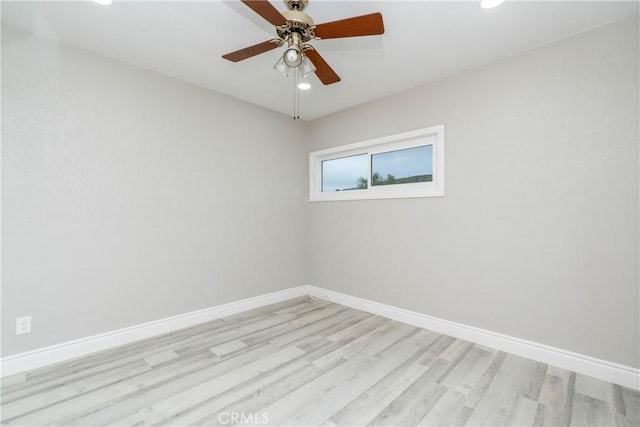 spare room featuring light wood-type flooring