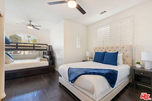 bedroom featuring ceiling fan and dark wood-type flooring