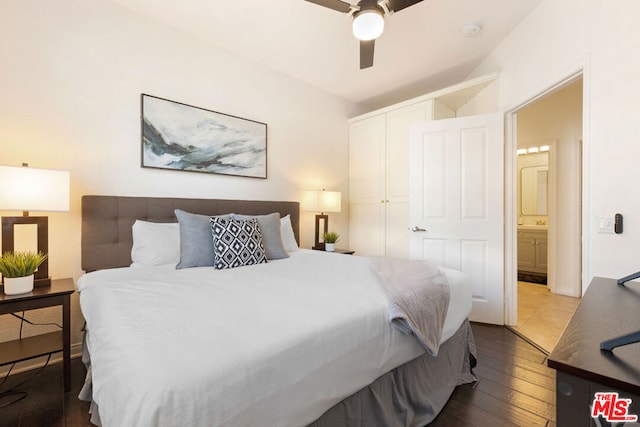 bedroom with wood-type flooring, ensuite bathroom, and ceiling fan