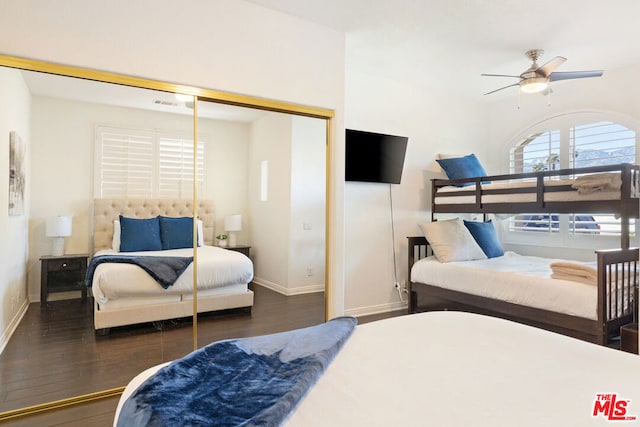 bedroom featuring dark hardwood / wood-style flooring, a closet, and ceiling fan