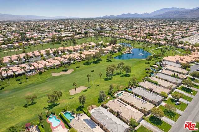 birds eye view of property featuring a water and mountain view