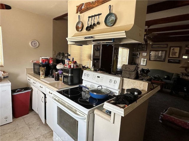 kitchen featuring ceiling fan, white cabinets, light tile patterned flooring, and white electric range