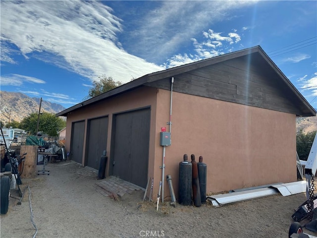 garage featuring a mountain view