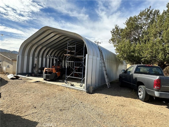 view of outdoor structure with a carport