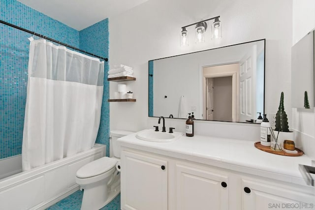 full bathroom with shower / tub combo, vanity, toilet, and tile patterned floors