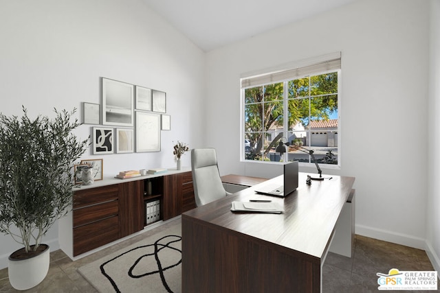 tiled office space with lofted ceiling