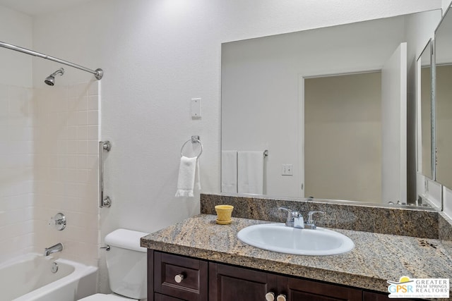 full bathroom with toilet,  shower combination, and vanity