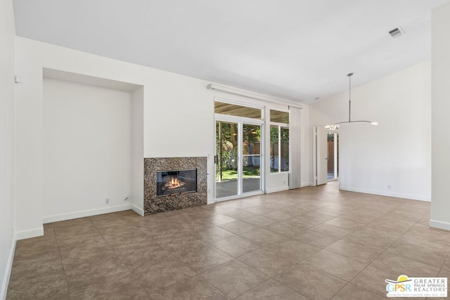 unfurnished living room with vaulted ceiling