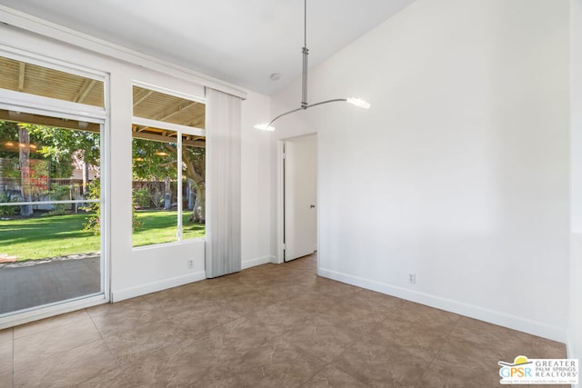 unfurnished dining area featuring vaulted ceiling