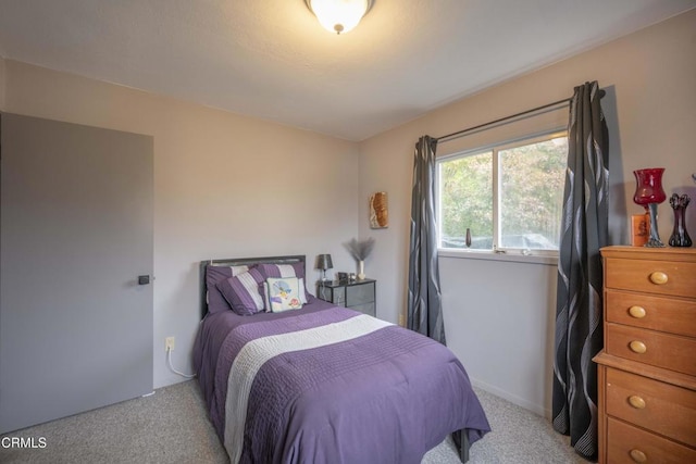 bedroom with light colored carpet