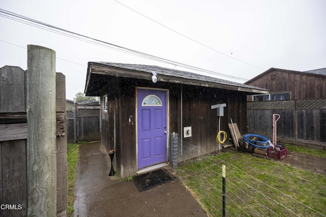 view of outbuilding with a yard