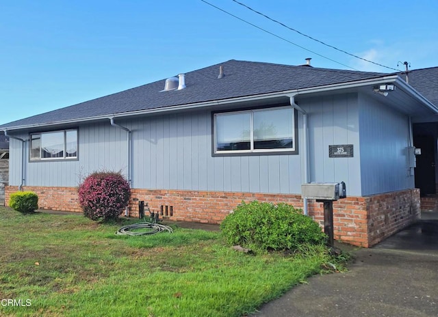 view of home's exterior with a yard