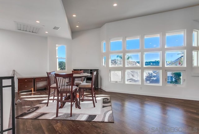 dining area featuring dark wood-type flooring