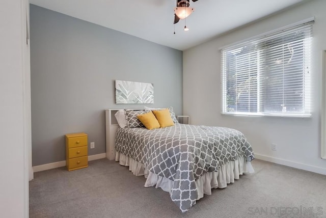 bedroom with ceiling fan and carpet floors