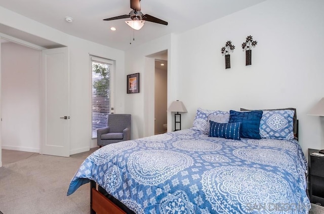 bedroom with light colored carpet and ceiling fan