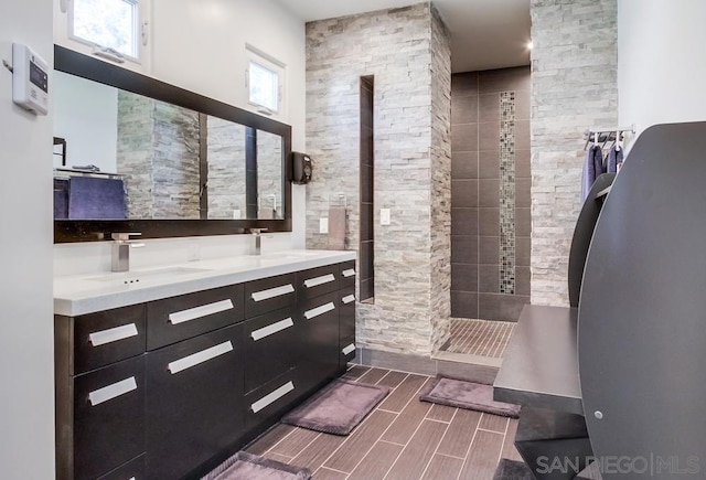 bathroom with a towering ceiling and vanity