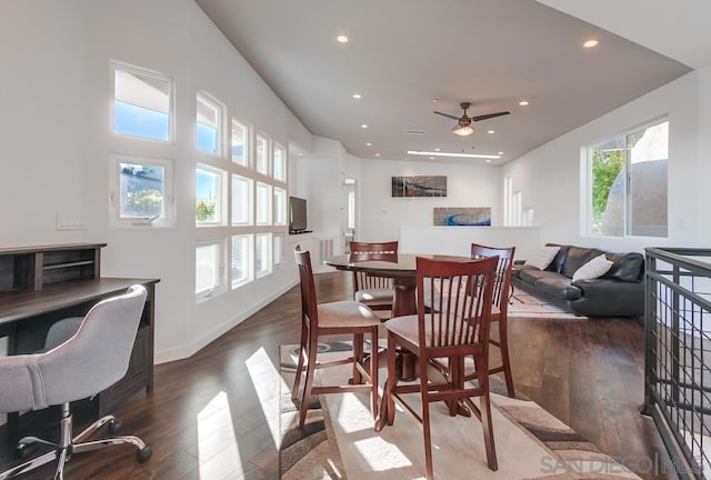 dining space featuring ceiling fan and dark hardwood / wood-style flooring