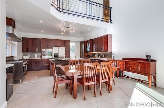 dining space featuring light tile patterned floors