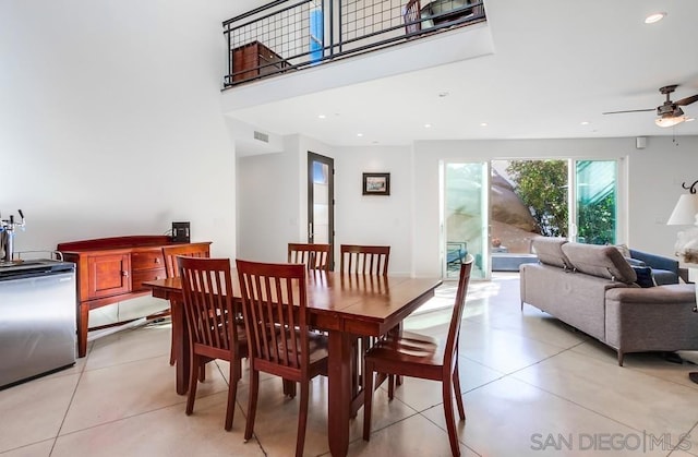 dining area with light tile patterned floors and ceiling fan