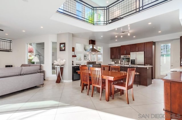 dining space featuring light tile patterned floors