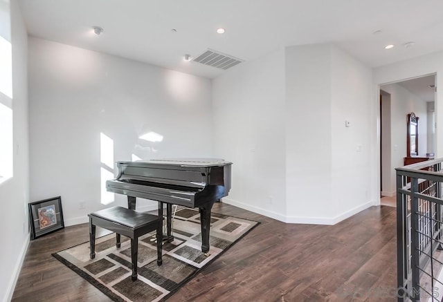 miscellaneous room with dark wood-type flooring