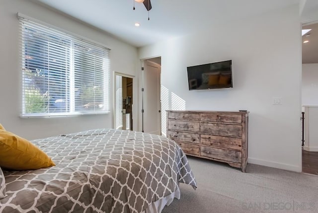 carpeted bedroom with ceiling fan