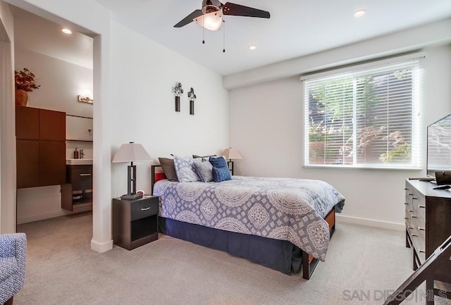 bedroom featuring ceiling fan and light colored carpet