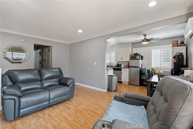 living room with ceiling fan, light hardwood / wood-style floors, and ornamental molding