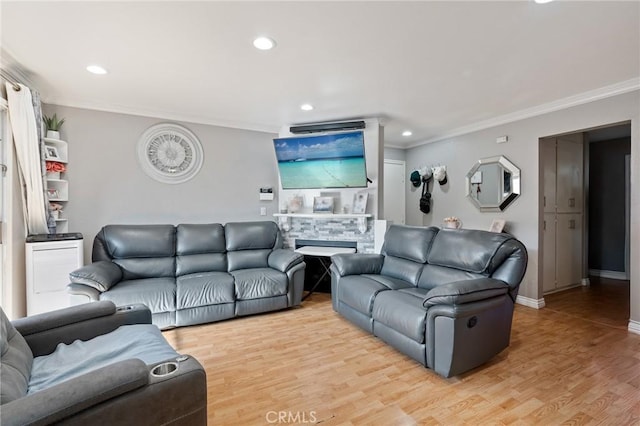 living room featuring a stone fireplace, crown molding, and light hardwood / wood-style floors