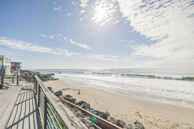 property view of water featuring a beach view