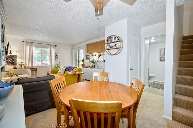 dining area featuring a textured ceiling