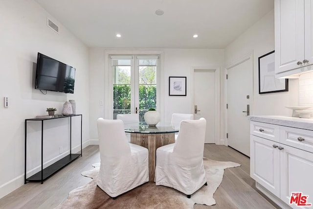 dining area with light wood-type flooring