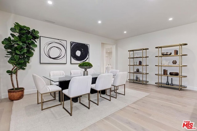 dining area with light hardwood / wood-style flooring