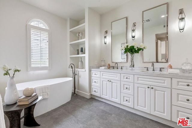 bathroom featuring vanity and a bathing tub