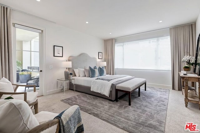 bedroom featuring light carpet