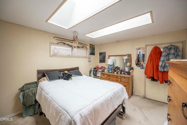 bedroom featuring light colored carpet