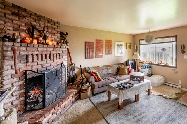 living room featuring carpet floors, a fireplace, and a baseboard heating unit